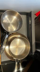 two large metal pans sitting in a microwave at Summerbreeze at Pyramid Point in Breadnut Hill