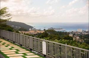 a balcony with a view of the ocean at Summerbreeze at Pyramid Point in Breadnut Hill