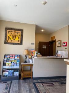 a store with a cash register and a counter at Wagon Wheel Hotel West Yellowstone in West Yellowstone +5 photos