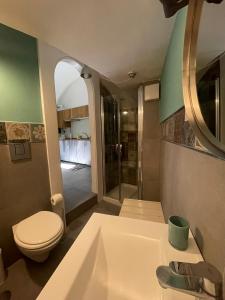 a bathroom with a toilet and a sink at The Lodge in Naples