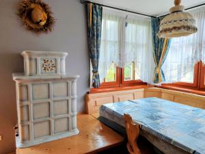 a dining room with a table and a table sidx sidx sidx at Appartamento Campitello House in Campitello di Fassa