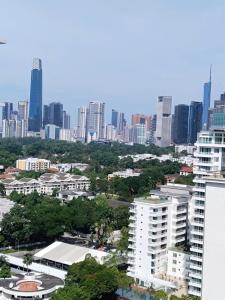 an aerial view of a city with tall buildings at Condo in Jalan Ampang- near KLCC IJN Gleneagles HKL TRX in Kuala Lumpur +1 photo