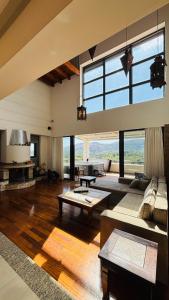 a large living room with a large window at Elena's Country Home & SPA in Kalithies