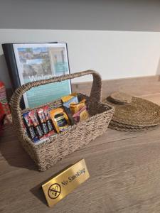 a basket with no smoking sign sitting on a floor at Luxury studio flat, Skipton in Skipton