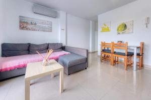 a living room with a couch and a table at El Rincon de Famara in Famara +12 photos