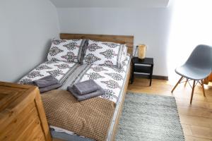 Postel nebo postele na pokoji v ubytování Apartamenty u Jakubika