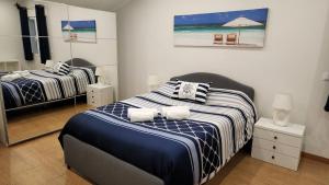 a bedroom with two beds and an umbrella and chairs at Villa Elysium in Ginetes +20 photos