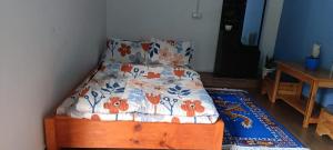 Ένα ή περισσότερα κρεβάτια σε δωμάτιο στο Eton Homestay