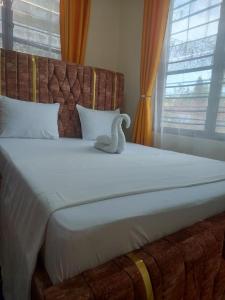 Postel nebo postele na pokoji v ubytování Nest Suites 2Bedroom Apartment