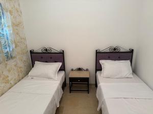 Postel nebo postele na pokoji v ubytování F3 et Piscine Port Yasmine Hammamet
