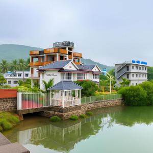a house on a bridge over a river at Vista Villa- A Riverside Villa in Alibaug in Mamnoli