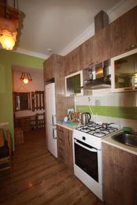 a kitchen with a sink and a stove top oven at Full Apartment in Yerevan