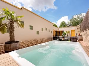a swimming pool in the backyard of a house at Peaceful Getaway with Spa in Avelgem