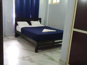 Katil atau katil-katil dalam bilik di Calangute Pristine Guest House