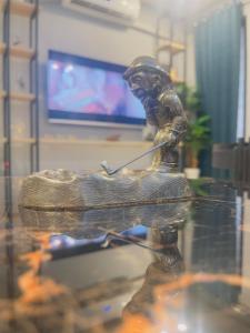 a statue of a baseball player swinging a bat at IMAR Services Apartment in Rawalpindi +31 photos
