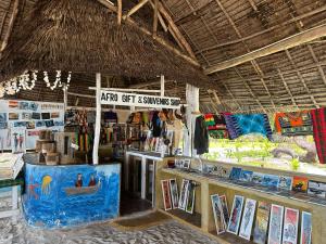 a shop with a sign that readsarro gift summer shop at AfroWhaleSharkSafari & AfroBeachBungalows in Kilindoni