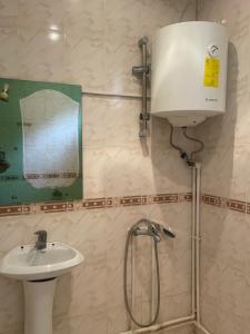 a bathroom with a sink and a shower at Nina B&B in Dilijan +33 photos