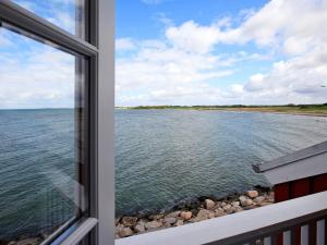 a view of the water from a window at Seaside Escape in Bagenkop - By Traum Ferienwohnungen in Bagenkop