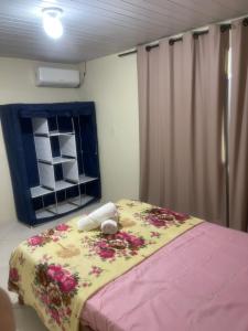 Giường trong phòng chung tại Casa do Aconchego