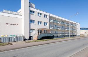 a large white building on the side of a street at Coastline _Nor31 _ 2_ in Westerland (Sylt)