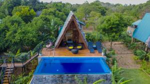 an aerial view of a house with a pool at Private Pool Sun Shade Resort & Spa in Habarana
