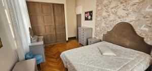 a small bedroom with a bed in a room at Al Pacino Family Lux Apartment in Rīga