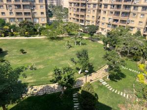 an aerial view of a park in a city at Modern Comforts Await! Spacious 2BR 2Bath w Free WiFi Stylish Furniture in Madinaty