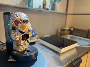 a mask sitting on top of a kitchen counter at Punta Aguzza in Aci Castello