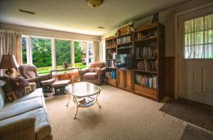 a living room with a couch and a coffee table at Majestic Maples - Quiet oasis with 2 king beds in Port Perry