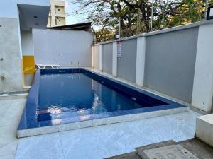 a swimming pool in the middle of a building at Seabreeze haven apartment in Mombasa