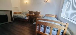Ένα ή περισσότερα κρεβάτια σε δωμάτιο στο Andover Garden Bungalow
