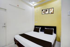Ένα ή περισσότερα κρεβάτια σε δωμάτιο στο Hotel O STAY INN