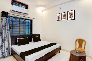 Ένα ή περισσότερα κρεβάτια σε δωμάτιο στο Hotel O STAY INN