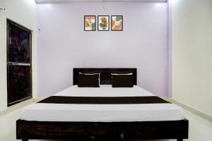 Ένα ή περισσότερα κρεβάτια σε δωμάτιο στο Hotel O STAY INN