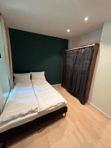 Ένα ή περισσότερα κρεβάτια σε δωμάτιο στο Apartment in Oslo +15 φωτογραφίες