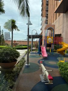 a playground with a slide and a play equipment at Times Square KL Serviced Suite in Kuala Lumpur