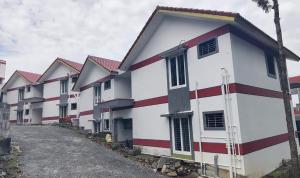 a row of houses with red and white at Richmount Natural Resort Private Limited in Salem