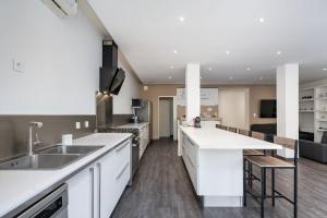 a kitchen with a sink and a counter top at Maison Frappaz in Villeurbanne