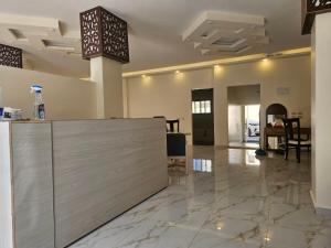 a lobby with a reception desk in a building at Petra Summit Hotel in Petra +28 photos