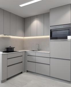 サンモリッツにあるGemütliches Studio in Champfer St Moritz - Vollständig renoviert ab Dezember 2025の白いキャビネットとシンクのあるキッチン