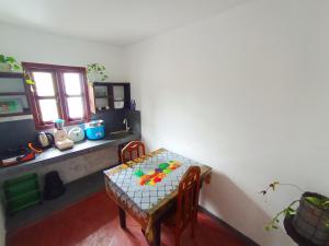 a room with a table and a table and a window at Bimsara Mount Villa in Weligama +31 photos