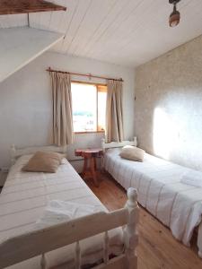 Postel nebo postele na pokoji v ubytování Akira Cabañas