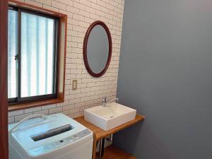 a bathroom with a sink and a mirror at HARUNA WING - Vacation STAY 26974v in Tsumagoi +32 photos
