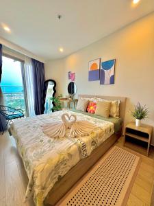 Ένα ή περισσότερα κρεβάτια σε δωμάτιο στο The Sóng Apartment Vũng Tàu - By Dina Nguyen