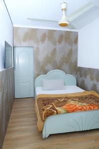 Ένα ή περισσότερα κρεβάτια σε δωμάτιο στο Green Hotel