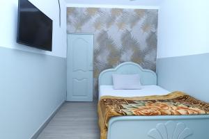 Ένα ή περισσότερα κρεβάτια σε δωμάτιο στο Green Hotel +1 φωτογραφίες