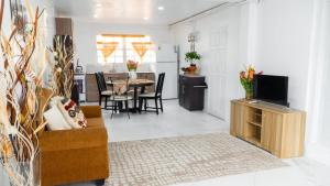 a living room with a couch and a table at Paradise cove villa in Gros Islet