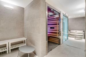 a room with a bench and a table and a chair at Townhouse in the heart of the city in Milan +12 photos