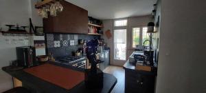 a kitchen with a stove and a counter top at L'Atelier in Perpignan +4 photos