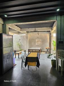 a dining room with a table and chairs in a room at Casa Tolentino Tagaytay - Full house in Tagaytay